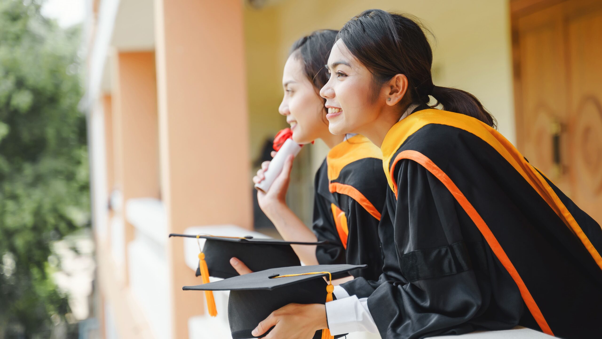 asian-university-graduates-graduation-gown-mortarboard-cap-with-degree-certificate-hand-celebrating-education-achievement-commencement-ceremony-congratulations-graduations (1)